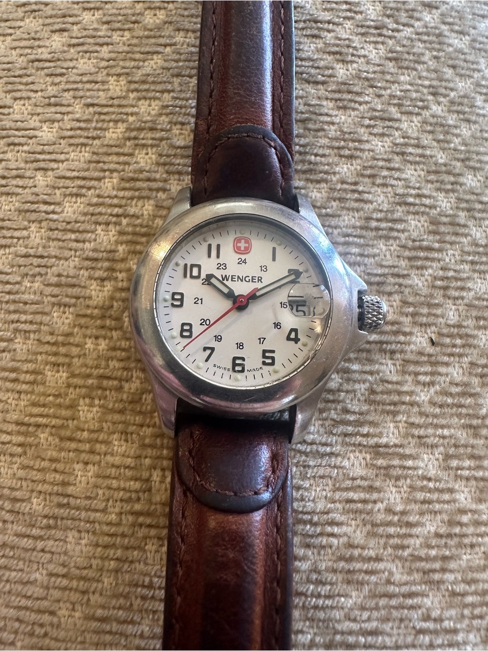 Wenger Stainless Steel Watch Case with Brown Leather Strap. Scratch top of date.